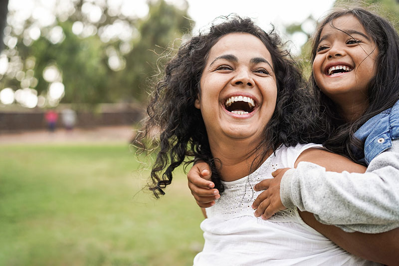 Mom and daughter laughing